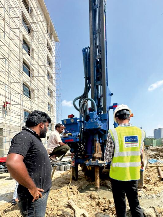 Micropiling rig and site engineers on a restricted-access foundation site in Bengaluru